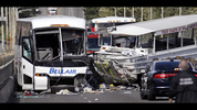 A charter bus, left, and an amphibious tour vehicle remain on the Aurora Bridge after colliding in a deadly crash involving several vehicles Thursday, Sept. 24, 2015, in Seattle. (AP Photo/Elaine Thompson) Click here for updates.